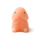 Small pink novelty rubber figure with two dot eyes, sold as a desk toy and prank add-on
